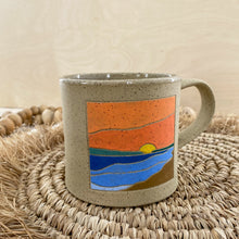 Load image into Gallery viewer, Round Lake, Sk Mug with Orange Sunset and Dark Sand
